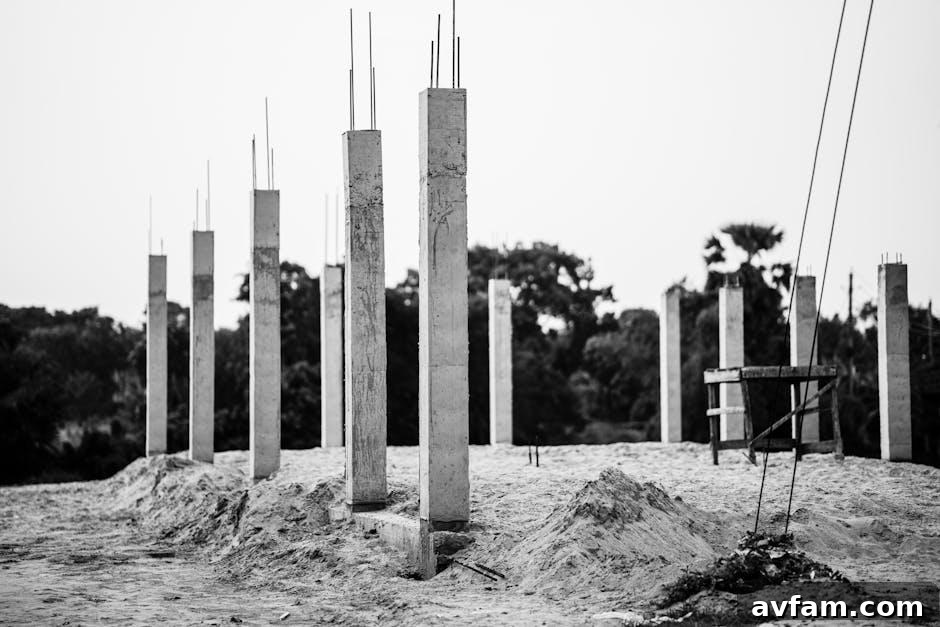 A steel helical pile being installed in the ground