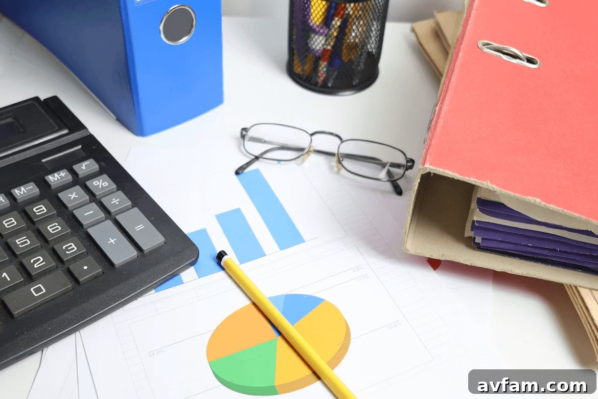 Desk with calculator, pen, glasses, and