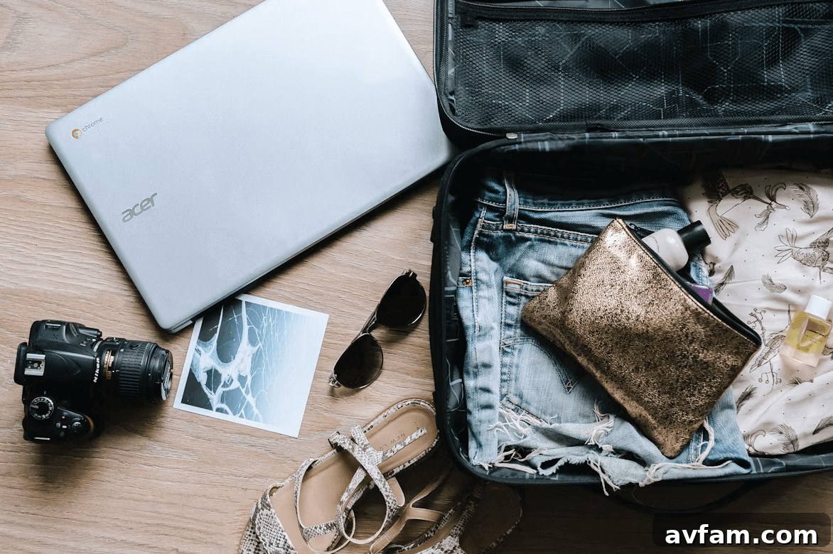 An open suitcase packed with clothes, a