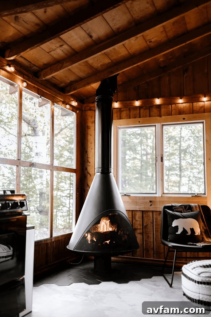 A living room with a gas fireplace stove and a