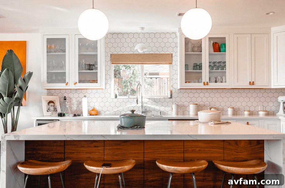 How to Organize a Vacation Home You Don’t Use Daily 2 Modern kitchen with a center island and three stools