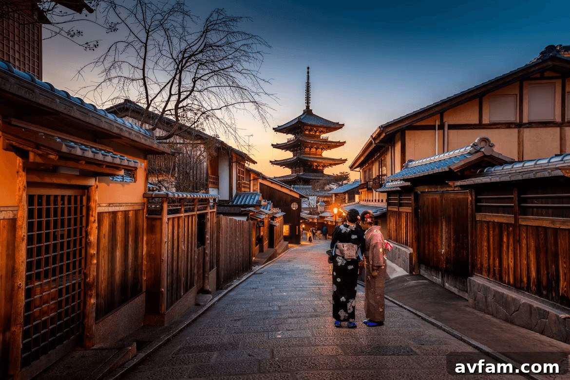 Two women walk down a metropolitan street with
