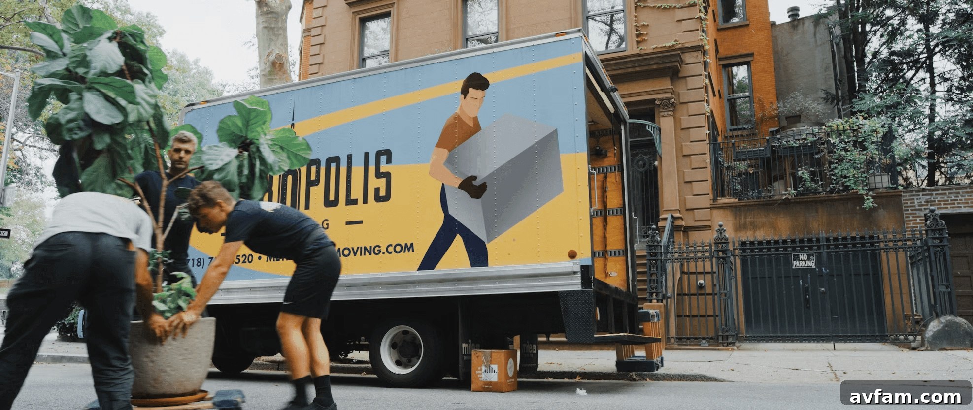 Couple standing next to a moving truck