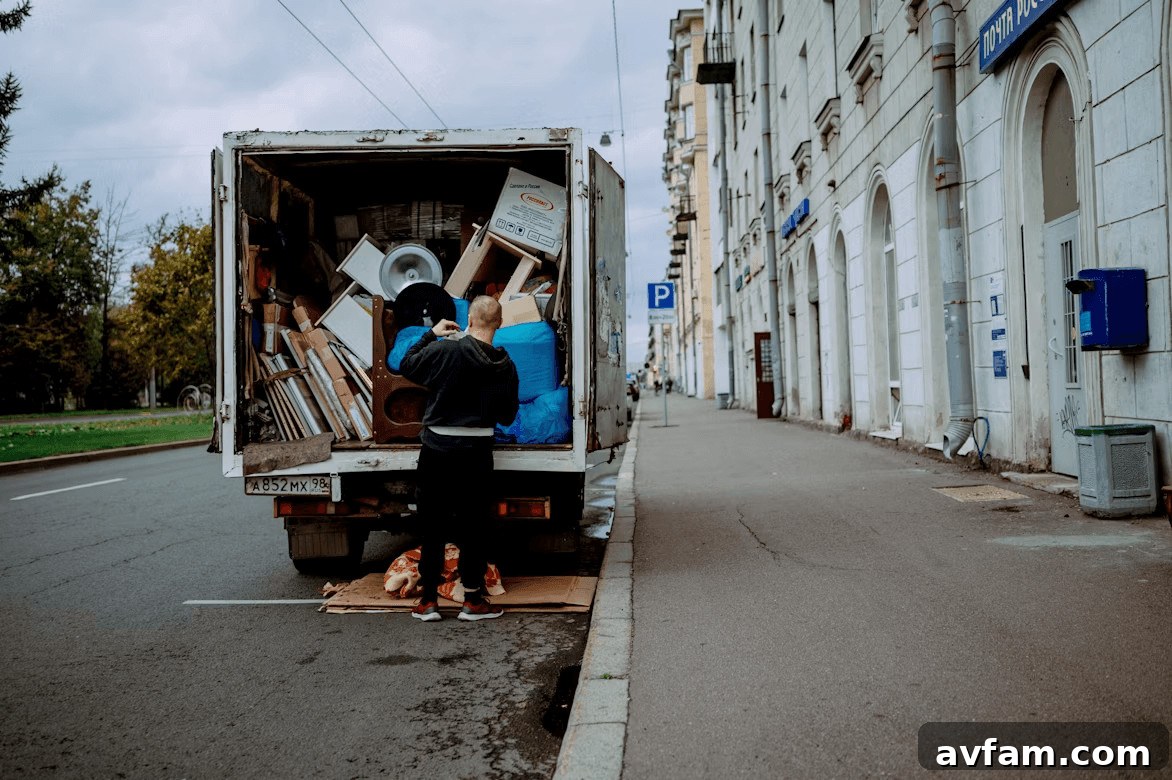 Man unloading furniture from a moving truck in McLean