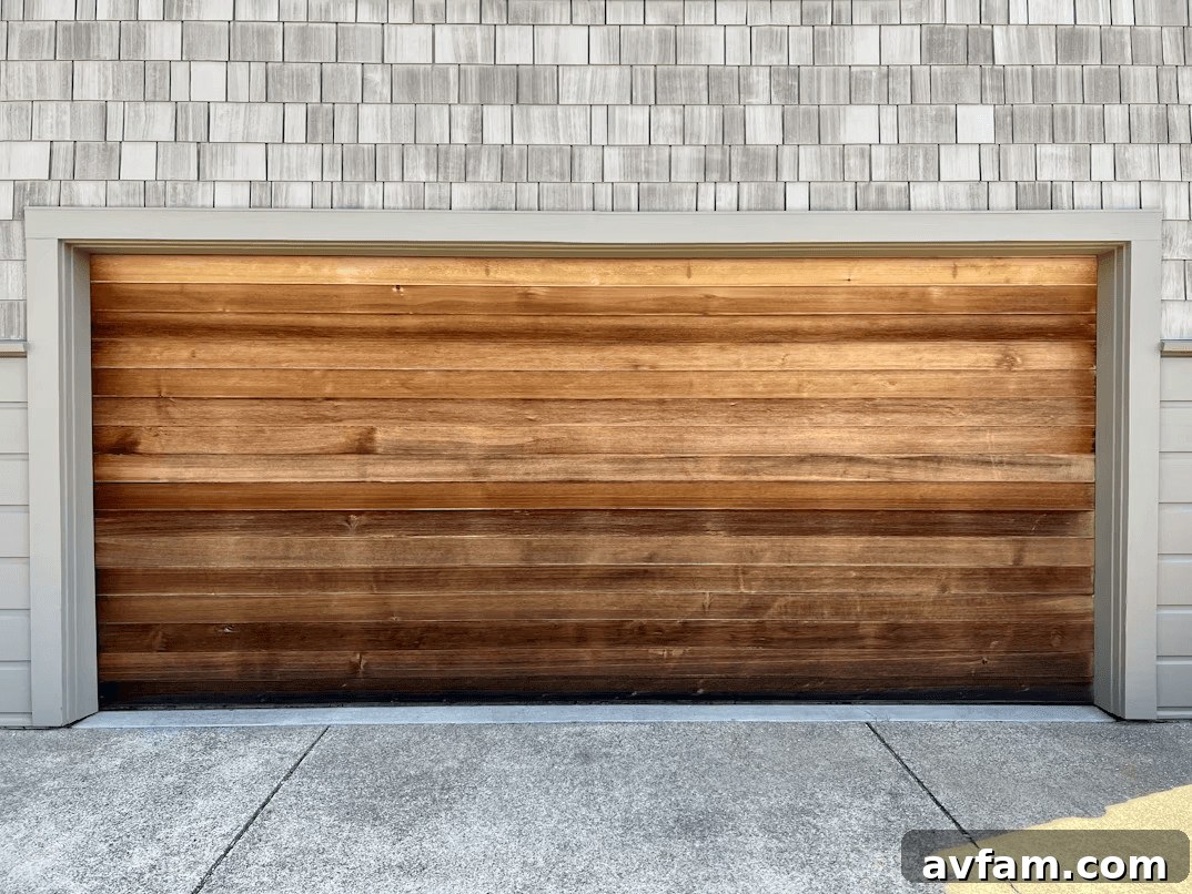 Wooden garage door on a brick home