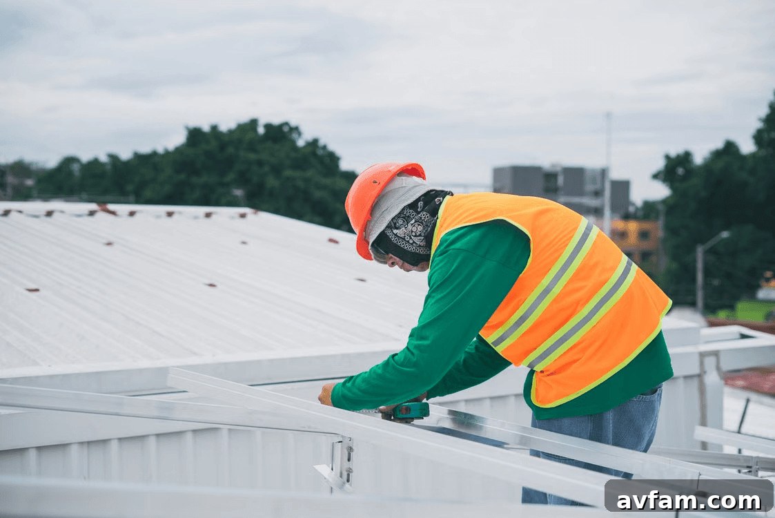 A roofing contractor in a safety vest inspects a