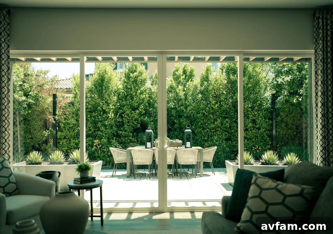 Transform Living Spaces with Retractable Screens 2 Modern living room with sliding glass door and