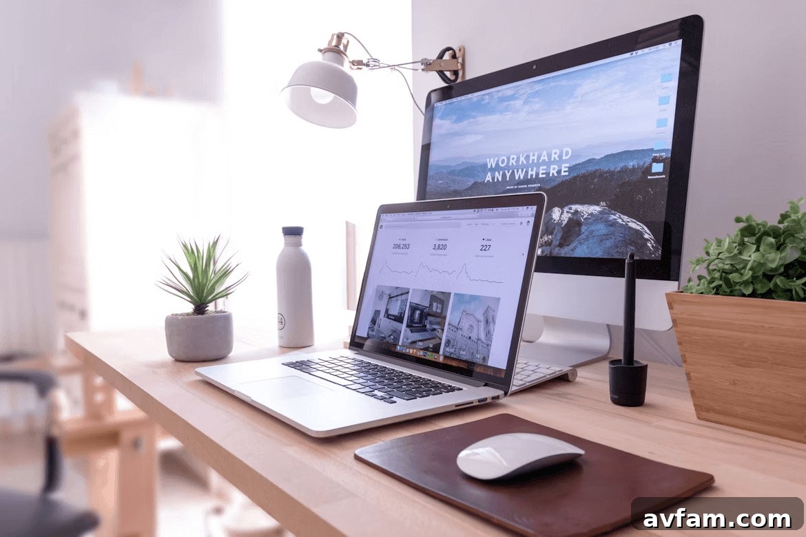 Laptop computer on a wooden desk, ready for remote
