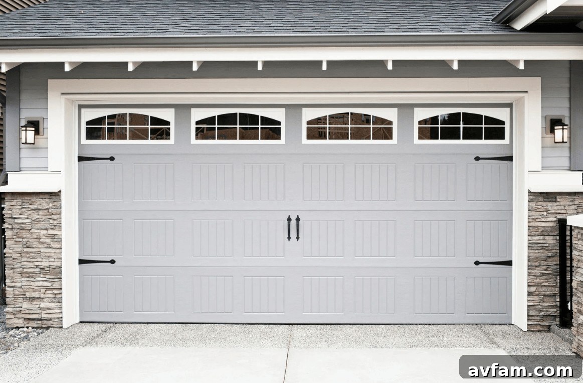 Is Your Garage Door the Weakest Link in Home Security? 2 Gray garage door with windows on a house