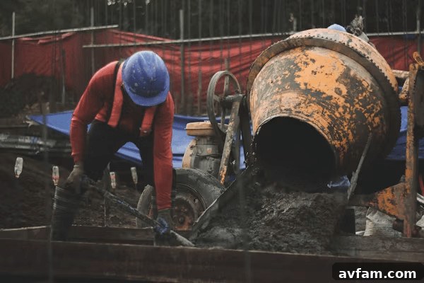 4 Home Projects to Schedule Around the Weather 2 Man in hard hat working on a home