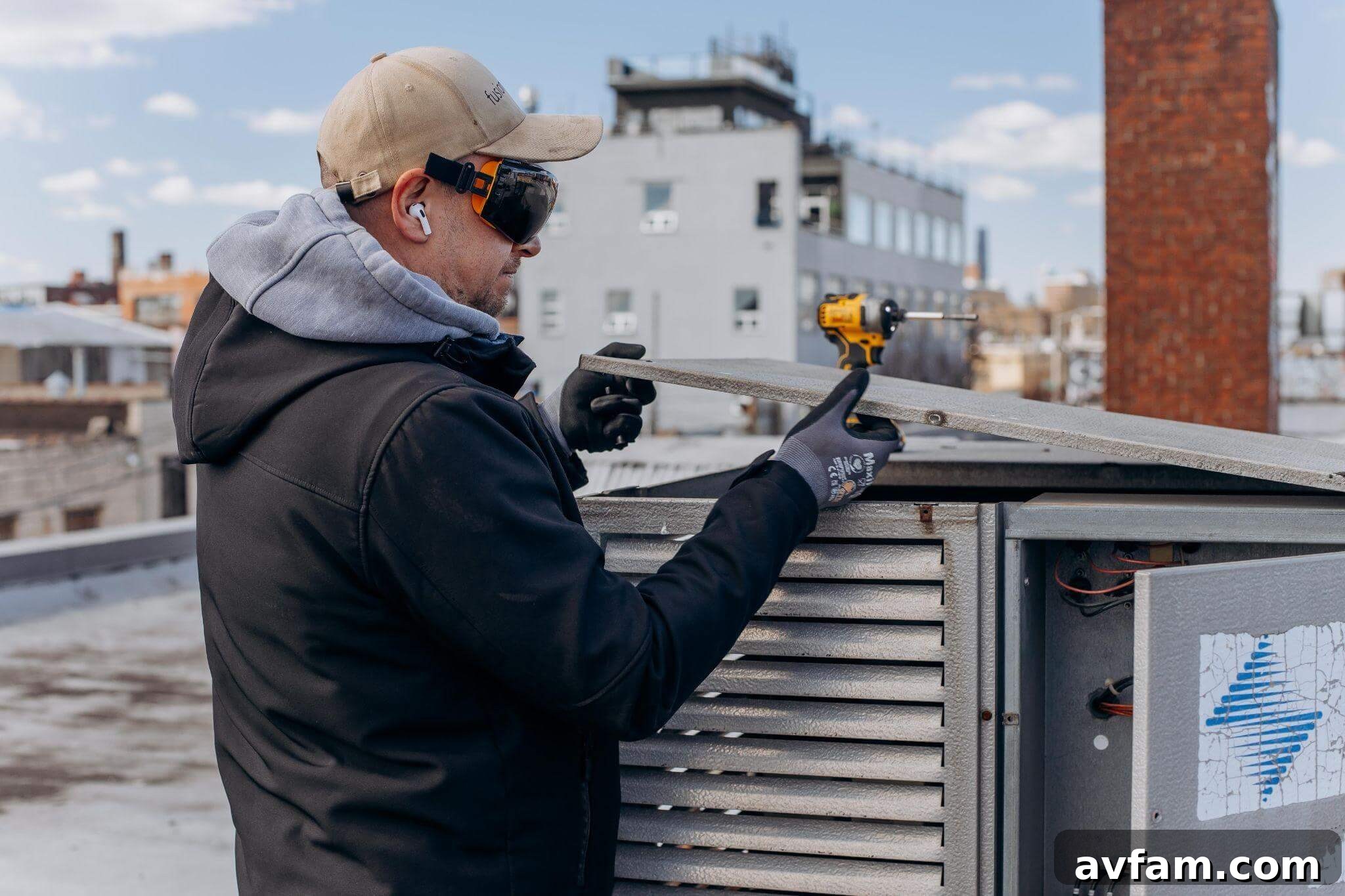 Man drilling on a roof for summer