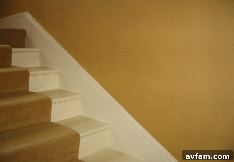 7 Reasons Mohawk Carpets Last Longer on Landings 3 White staircase with yellow wall, mohawk carpet