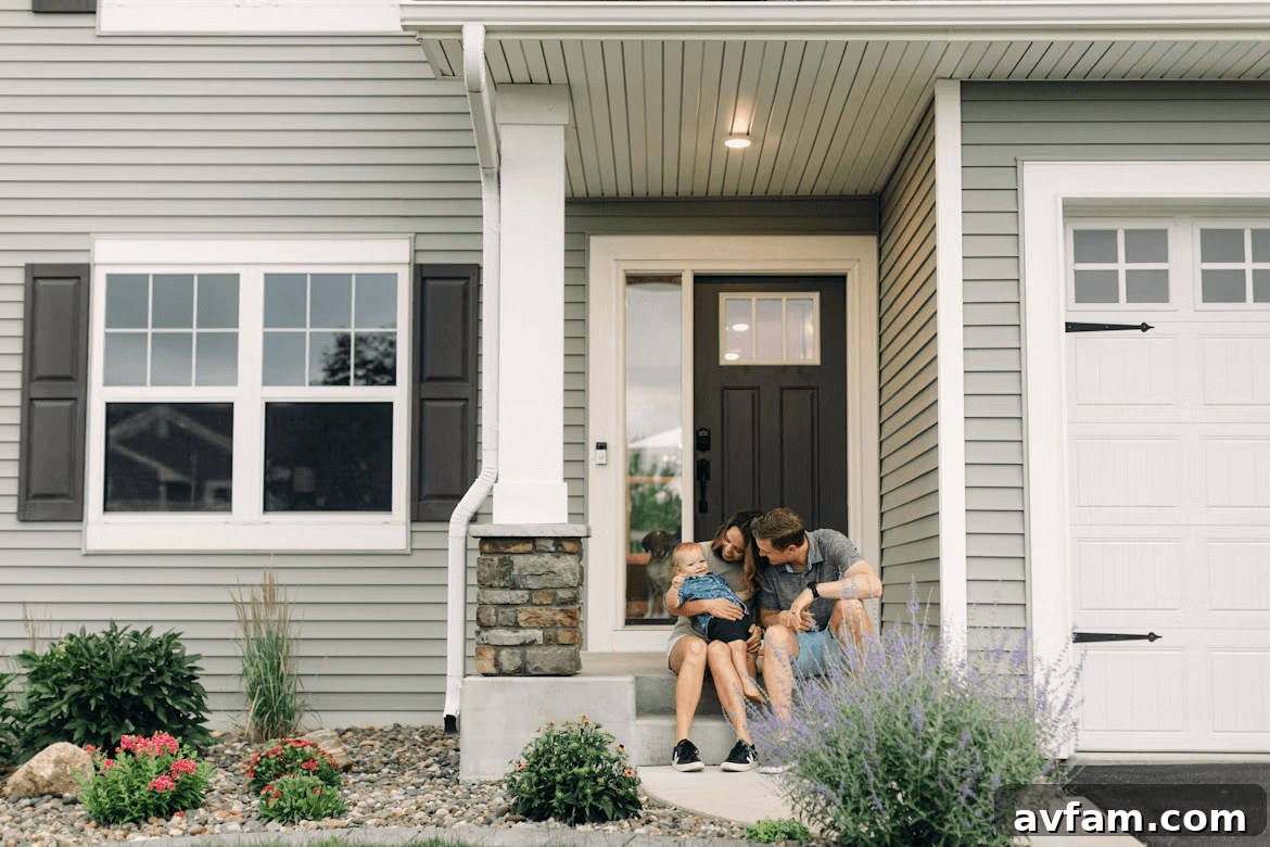 Couple sitting in front of a house