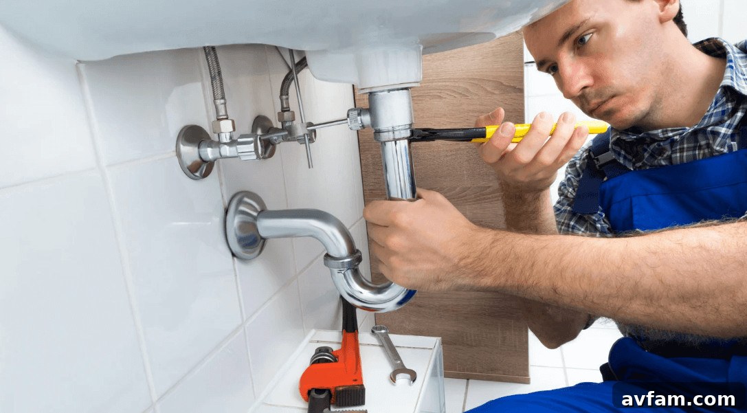 Home Renovations That Require a Professional Plumber 3 A pro pumbler fixing a bathroom sink