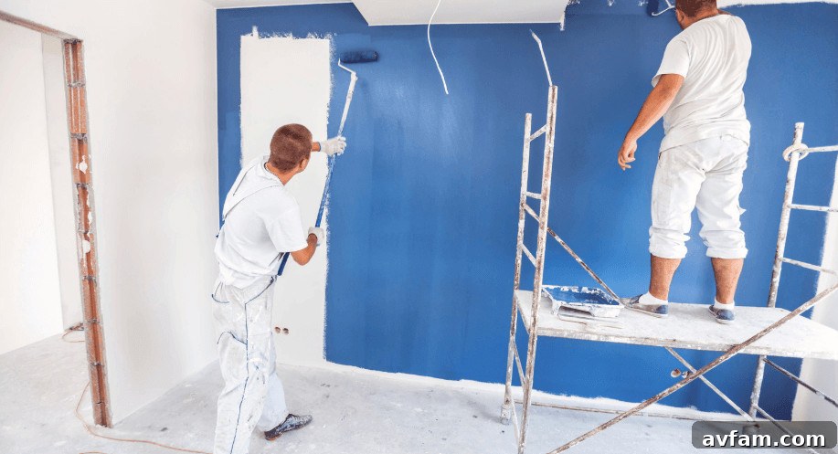 Top 7 Denver Painting Companies for Homes and Businesses 2026 2 painting the wall with blue