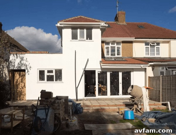 Large white house with many windows ready for home