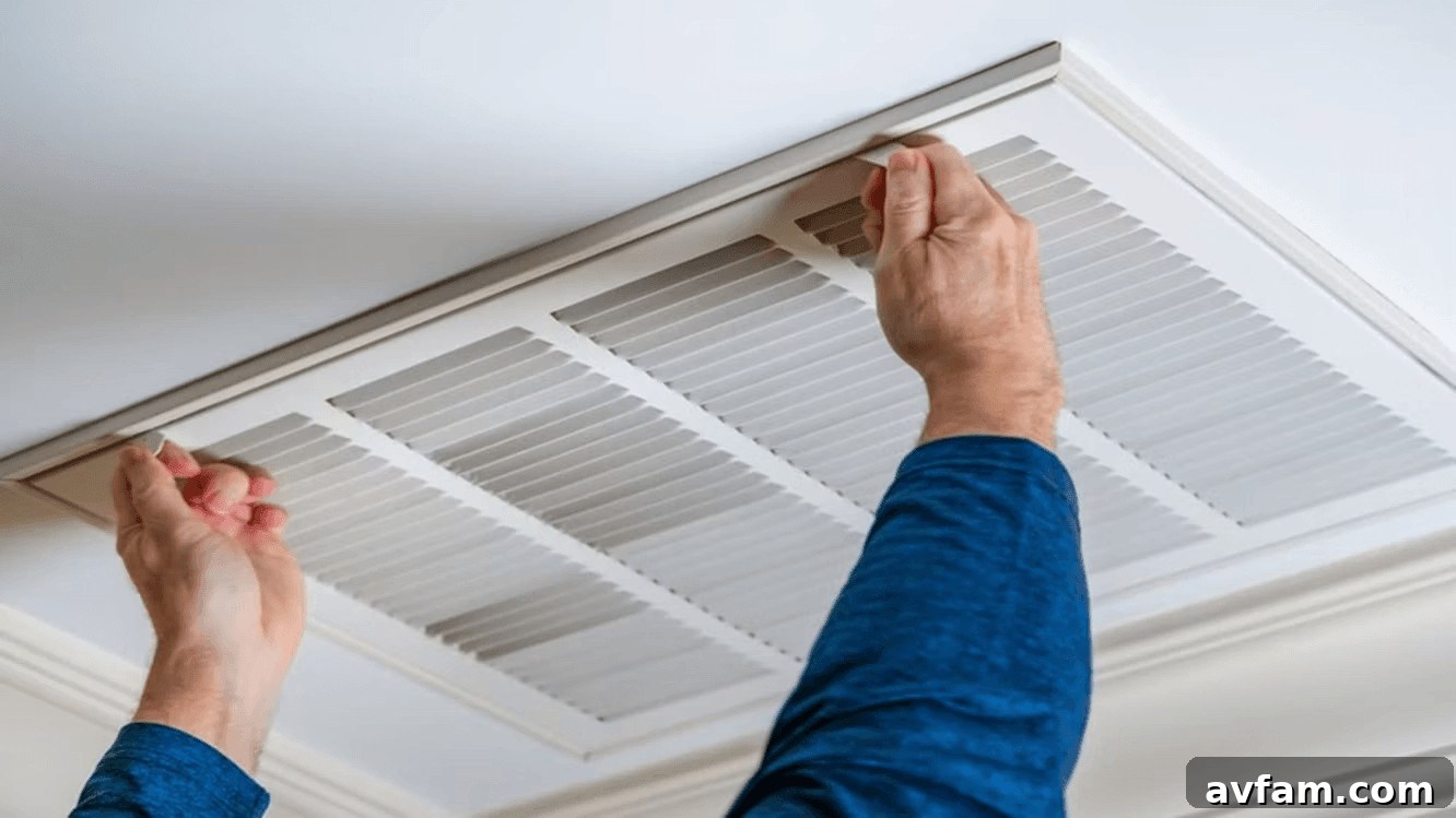 Technician working on ceiling air conditioner