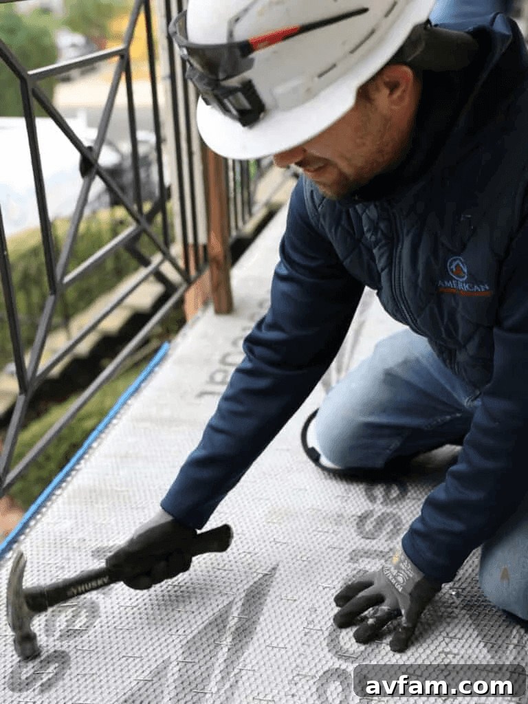 Man in hard hat and safety gear working on